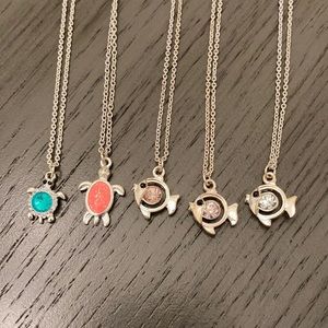 Set of 5 Claire’s necklaces. 3 with fish charms and 2 with turtle charms